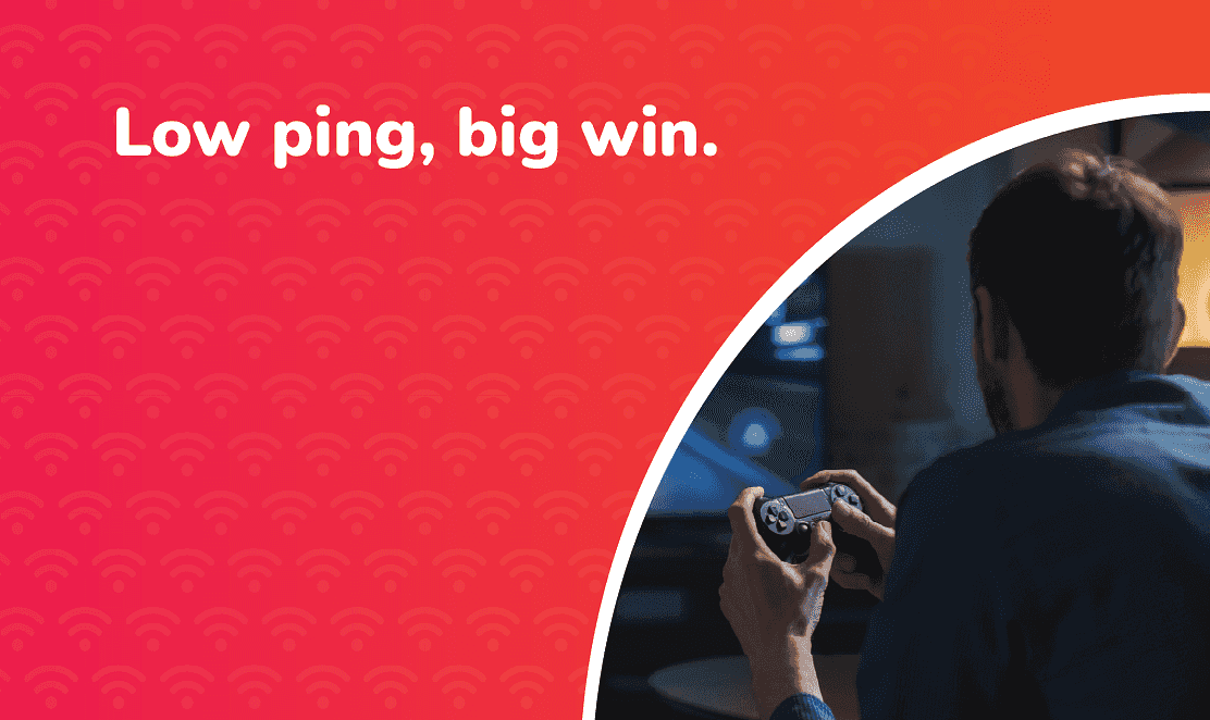 A gamer playing on a console at home with the text “Low ping, big win” promoting Fusion Fibre Group’s low-latency full fibre broadband for smoother gaming performance in the UK.