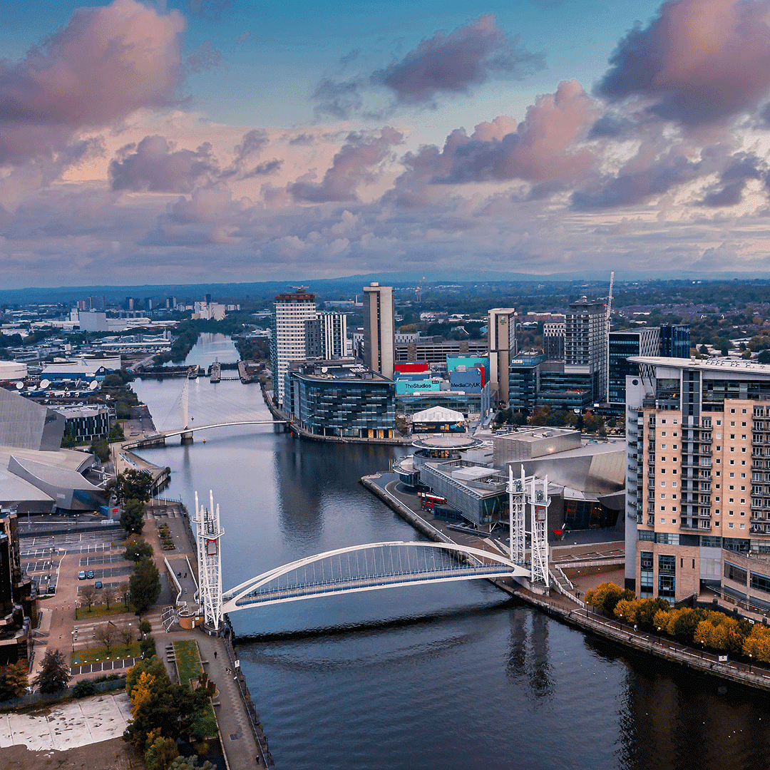 Aerial view of Salford Quays and MediaCityUK in Greater Manchester, home to leading businesses and cultural hubs, with ultrafast full fibre broadband from Fusion Fibre Group connecting homes and businesses across the region.