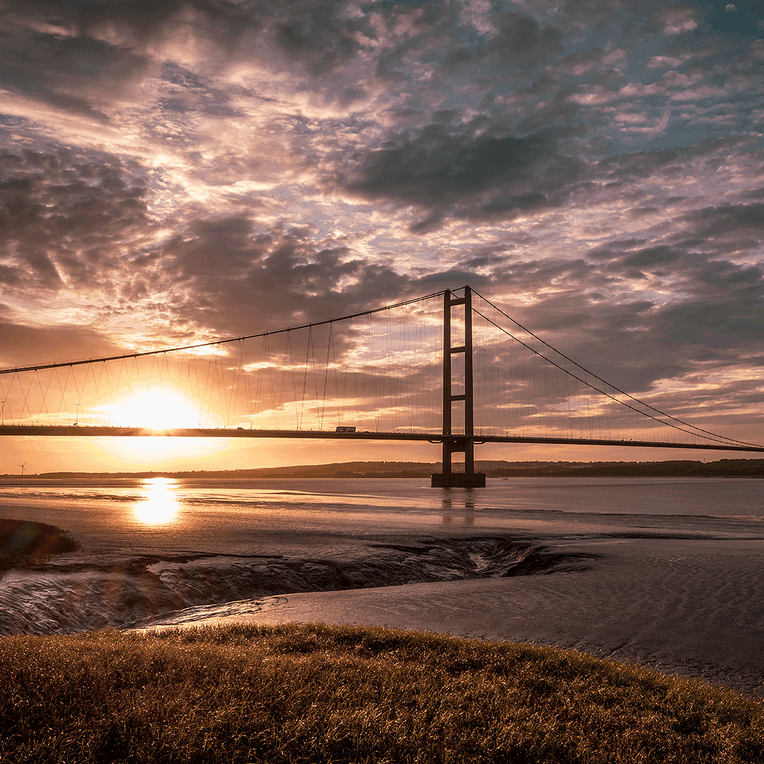 Sunset view of the Humber Bridge from Hessle, East Yorkshire, spanning the River Humber.
