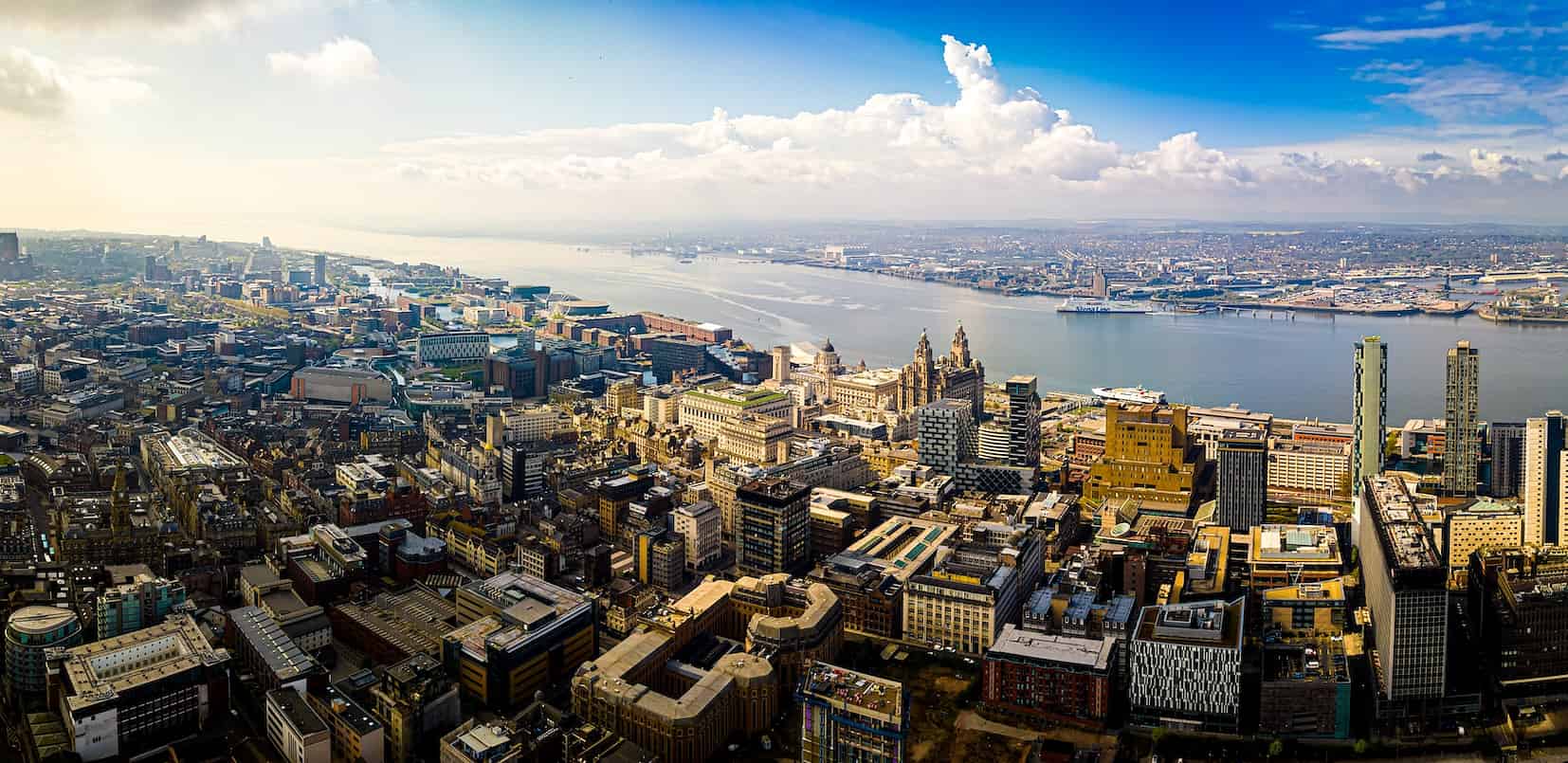 Panoramic aerial view of Liverpool city centre and River Mersey waterfront – full fibre broadband coverage in Liverpool by Fusion Fibre Group.