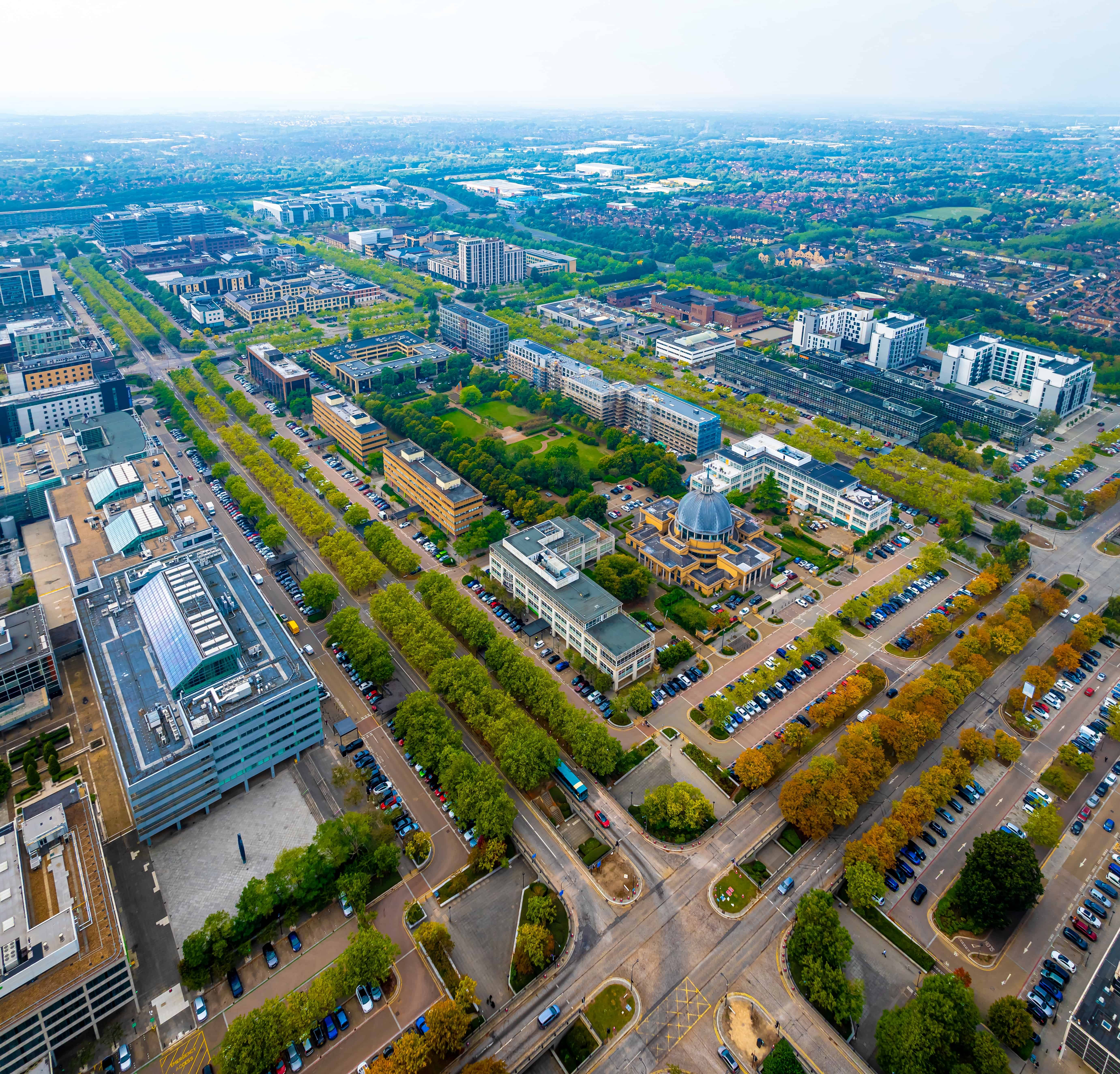 Fusion Fibre Group bringing full fibre broadband to Milton Keynes – aerial view of the city’s grid road layout, offices, and homes.
